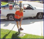 city worker opening water meter